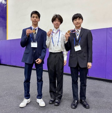 Akhil, Lucas, and Evann at one of their first science fairs in middle school. The three students hold their medals for the photo.