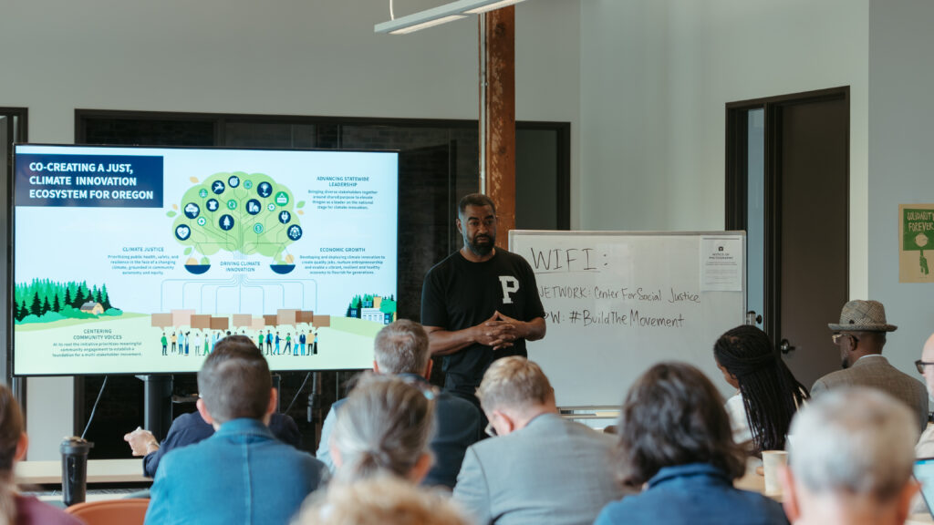 Kory Murphy leads a presentation at the front of a room.