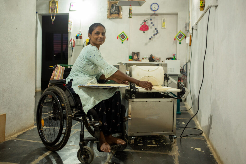 Jayashree, is an entrepreneur who uses a wheelchair, is shown making bread.