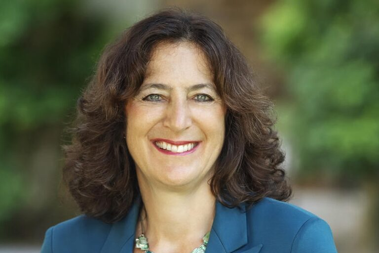 Andrea Goldsmith smiles in a headshot photo.