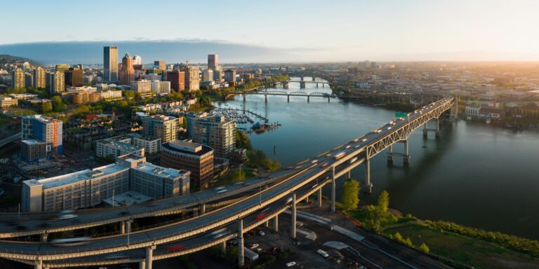 Aerial view of a bridge in downtown Portland, Oregon at sunrise.