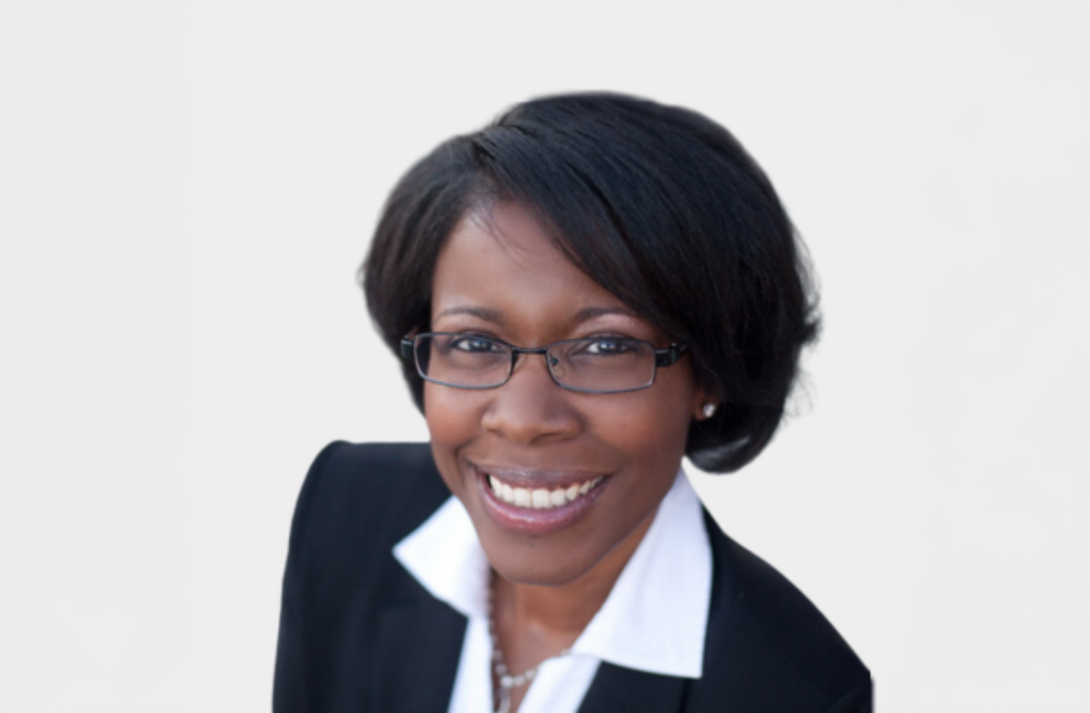 Monique Dyers smiles in a headshot.