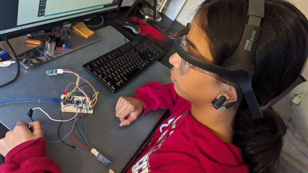 Anuki wears the EEG device that detects brain waves while testing NeuroBreath. 
